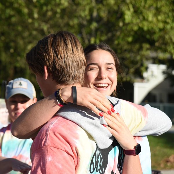 Photo of youth race day participants hugging